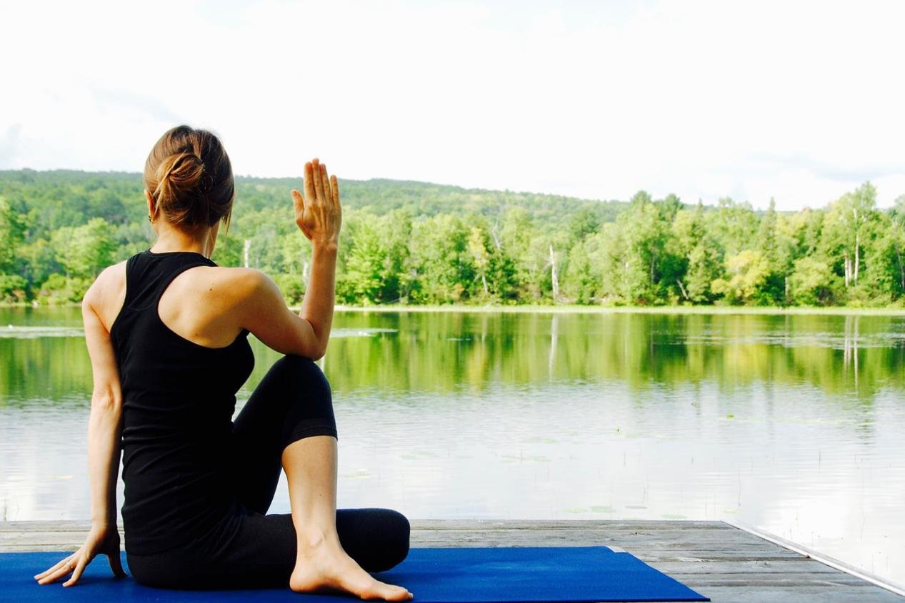 Yoga position on dock at lake