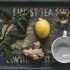 tea cup with lemon and ginger on wood serving tray