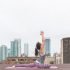 Yoga position against cityscape